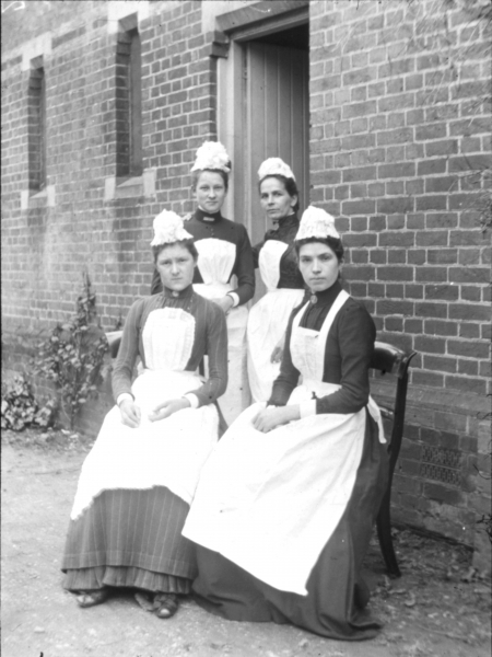 Four domestic maids (b/w photo)  from English Photographer