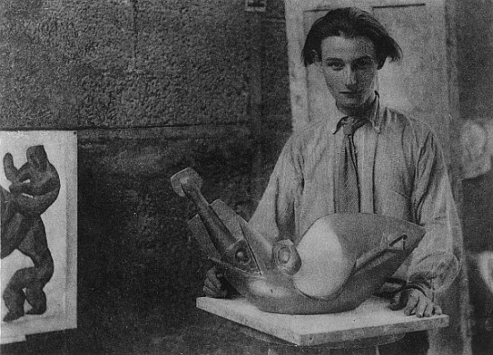 Henri Gaudier-Brzeska with his sculpture ''Bird Swallowing Fish'' in Kettle''s Yard, University of C from English Photographer
