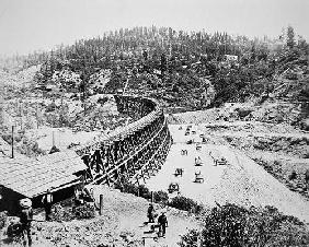 Chinese labourers working on a trestle bridge on the western slope of the Sierra Nevada mountains, 1