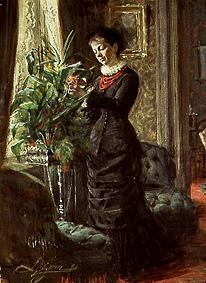 Frau Lisen Samson beim Arrangieren von Blumen vor einem Fenster from Anders Leonard Zorn