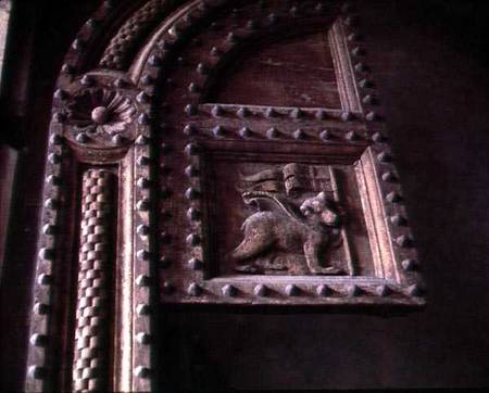 Carved door panel from the Duomoshowing a bear cub carrying a flag from Anonymous