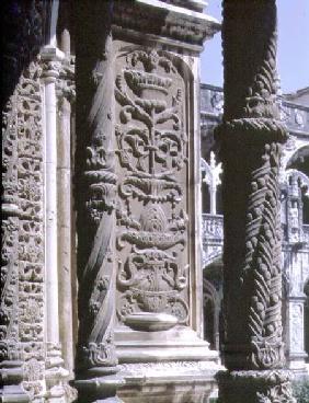 Detail of a column and a high relief in the North Gallery of the Cloister of the Monastery