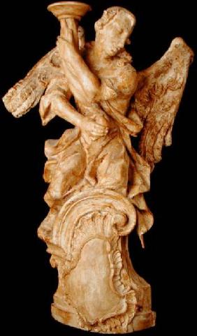 One of a pair of carved angel candlesticks