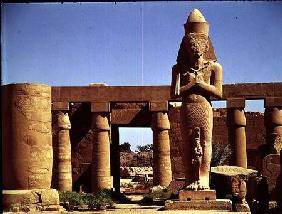 The Colossus of Ramesses II: standing statue of the king with his daughter Benta anta in front of hi