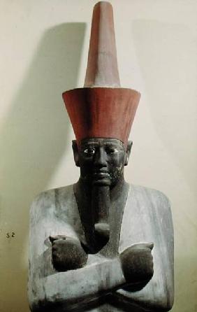 Detail of a statue of Mentuhotep II, enthroned and wearing the red crown of Lower Egypt, taken from