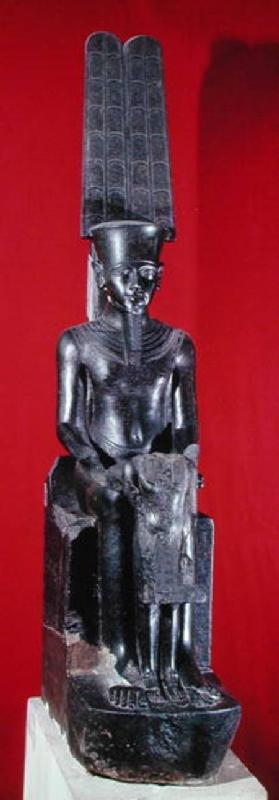 Seated statue of the god Amon protecting Tutankhamun, New Kingdom