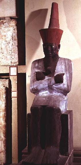 Statue of Mentuhotep II, enthroned and wearing the red crown of Lower Egypt, taken from the Mortuary