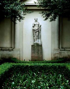 View of the garden, detail of a female antique statue, garden designed