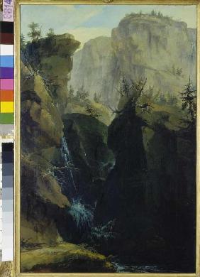 Felsenschlucht mit Passweg und Wasserfällen, von Bergen überragt.
