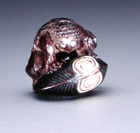 Netsuke depicting a kappa crouching on a clam shell from Komin