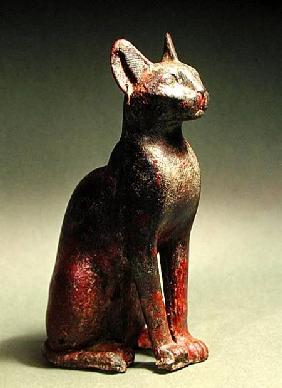 Statuette of a cat with gold earrings, the sacred representation of the goddess Bastet
