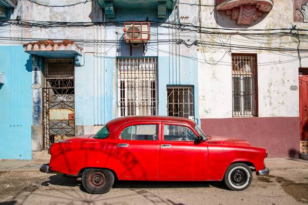 Red Oldtimer in Havana, Cuba. Street in Old Havana from Miro May