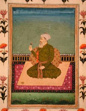 A ruler seated on a carpet or terrace, holding a flower, from the Small Clive Album