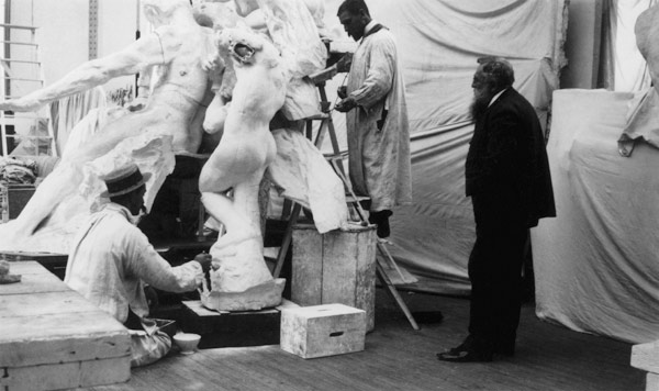 Auguste Rodin (1840-1917) in his Paris studio watching the construction of a sculpture, 1905 (b/w ph from 