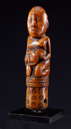 A Kongo Ivory Staff Finial Depicting A Kneeling Female Figure Holding A Child from 