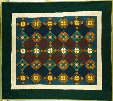 An Amish Pieced & Quilted Cotton Coverlet Worked In A Variation On The Nine Patch Pattern, from 