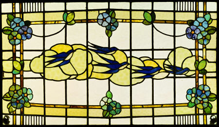 An Arts And Crafts Leaded And Stained Glass Panel Of A Group Of Swallows Before Clouds In A Border O from 