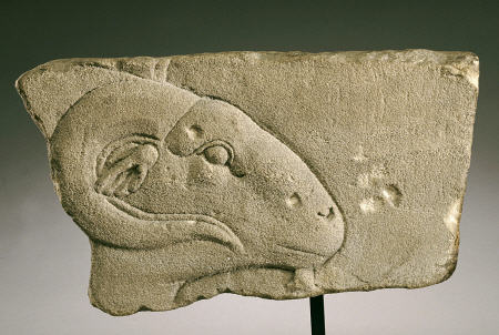 An Egyptian Gray Sandstone Relief Of A Rams Head from 