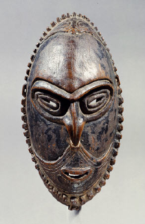 A New Guinea Mask Of Oval Form With Pierced Eyes, Mouth And Septum from 