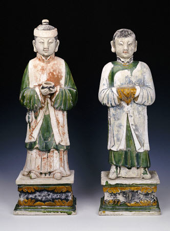 An Unusual Pair Of Glazed And Painted Pottery Figures Of Attendants from 