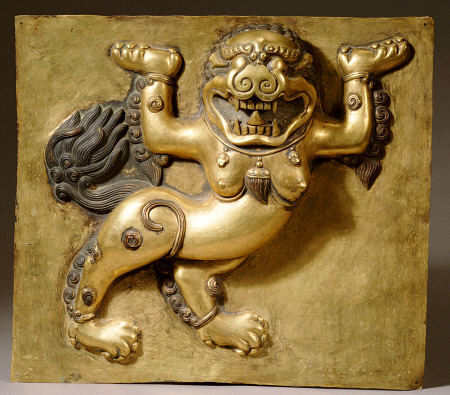 A Tibetan Gilt-Copper Panel Cast In Deep Relief With A Lion, Standing On Both Hind Legs, 18th Centur from 