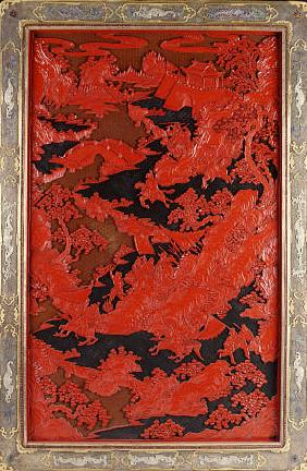 A Filigree Framed Red Lacquer Panel Depicting Warriors On Horseback And Mythical Animals In A Landca