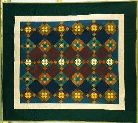 An Amish Pieced & Quilted Cotton Coverlet Worked In A Variation On The Nine Patch Pattern,