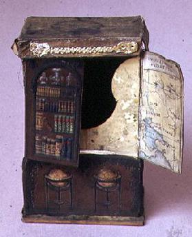 Doll's house furniture: Cardboard bookcase, embossed inside showing a map with the new Australian go