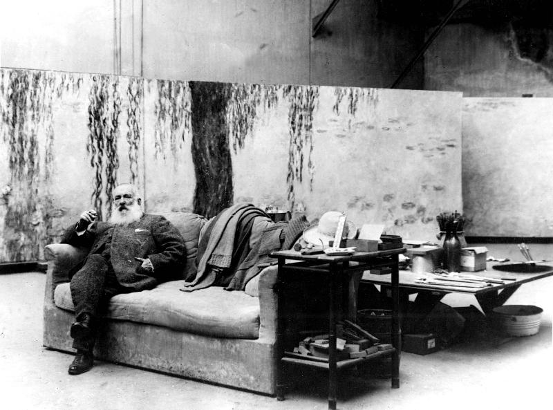 French painter Claude Monet in his workshop in front of one of his paintings Waterlilies from 