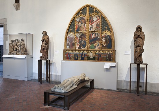 Interior of the gallery with an altarpiece and sculptures from 