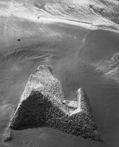 Rock on sand (b/w photo)  from 