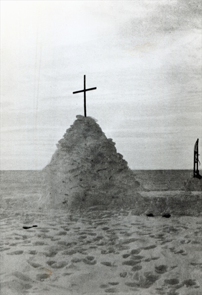 The tomb of Scott of the Antarctic and his companions, Bowers and Wilson, marked by a mound of snow, from 