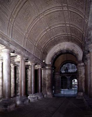 The atrium, with red granite columns and a coffered barrel vaulted ceiling, designed by Antonio da S from 