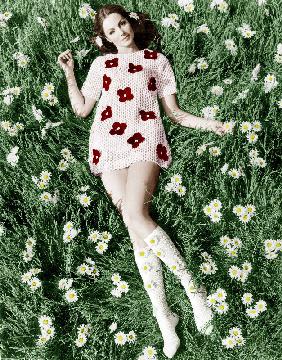 Young model Biddy Lampard in the grass wearing a short dress inspired by Courreges colourized docume