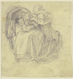 Ein Mädchen sitzt bei einer Wiege und hält mit beiden Armen umfaßt ein kleines Kind auf ihrem Schoß,
