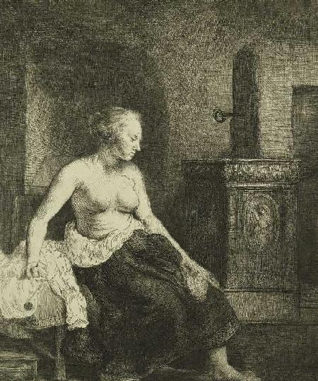 Sitzende Frau an einem Ofen