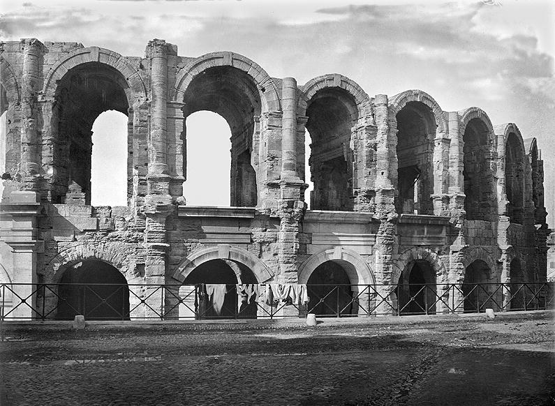 Exterior view of the amphitheatre (stone) (b/w photo)  from Roman