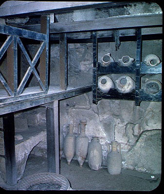 Interior of a shop with amphorae, from the House of Neptune and Amphitrite (photo) from Roman 1st century AD