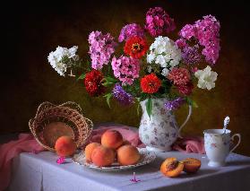 Still life with summer bouquet and peaches