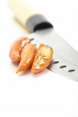 Gelbe Peperoni mit Messer from Thomas Haupt